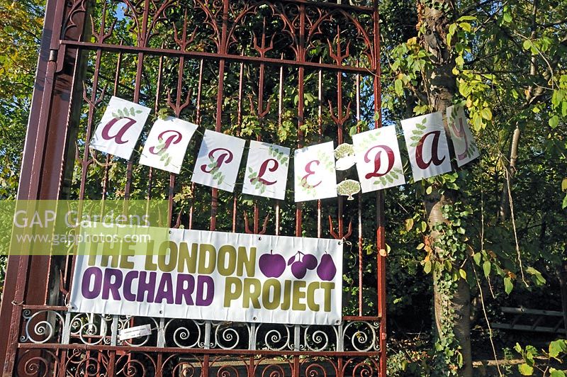 Apple Day, London Orchard Project sign displayed on the entrance gates to Camley Street Natural Park King's Cross, London Borough of Camden, UK