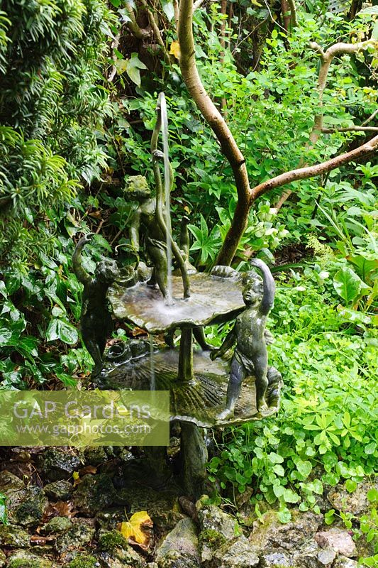 Small water feature with cherubs - The Crossing House, Shepreth, Cambridgeshire.