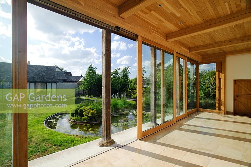 Yoga studio looking out through sliding doors to oriental style garden - Butts Farm, Pond Green, Wicken, Cambridgeshire