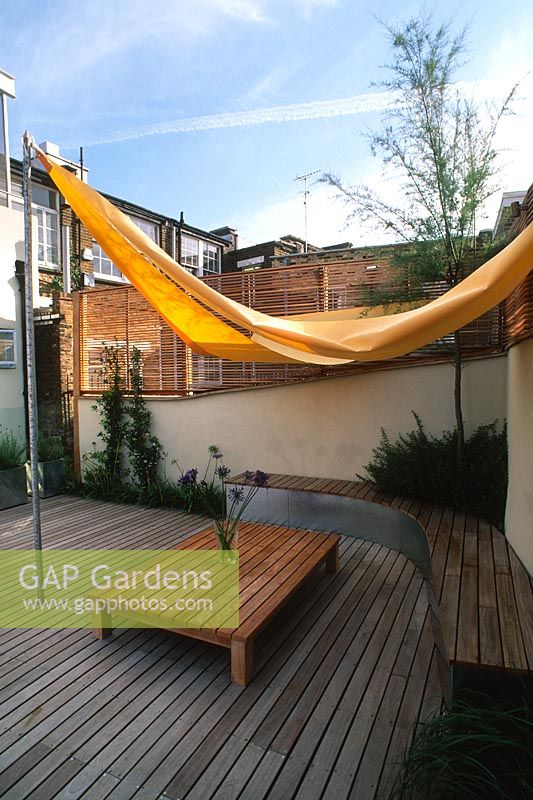 Contemporary roof garden with wooden deck, canvas awning and trough containers -Clerkenwell, London, England, USA 