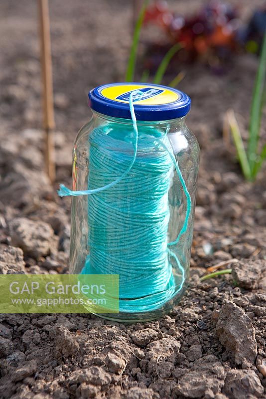 A useful way of keeping gardener's nylon string from getting knotted up is to keep it in a glass jar