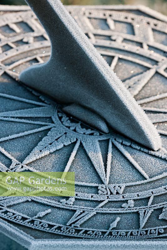 Close up of sundial covered with frost 