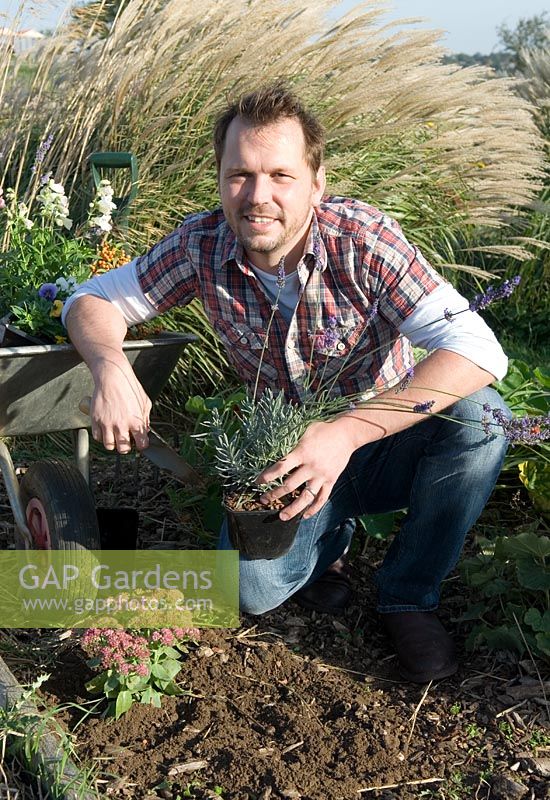 TV celebrity farmer Jimmy Doherty stocking his wildlife garden with plants to attract butterflies, bees and other insects - Jimmy's Farm, Ipswich, Suffolk