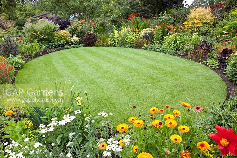 Circular lawn surrounded by flowerbeds 