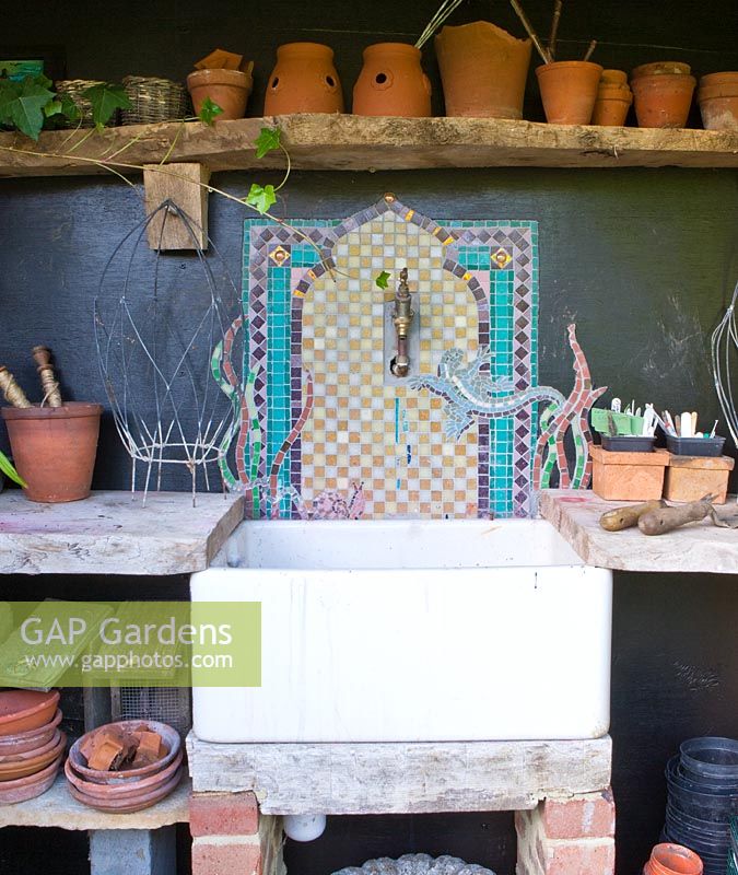 Potting area with butlers sink with mosaic back