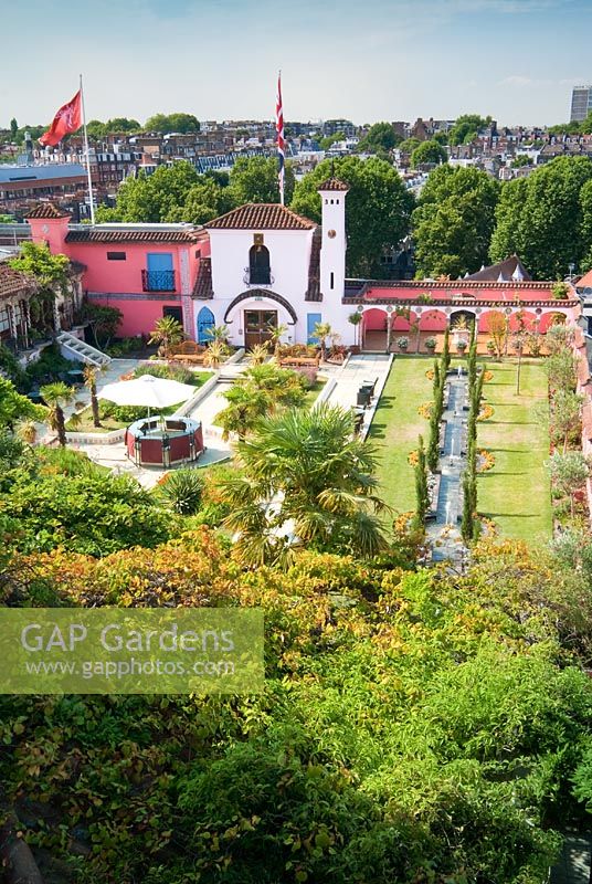 View of The Spanish Garden at The Roof Gardens, Kensington with city beyond