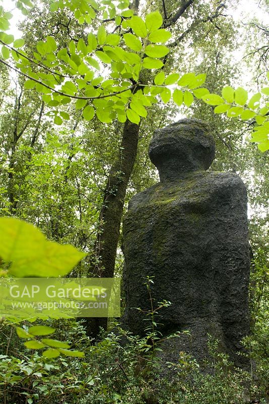 Giant statue within garden setting