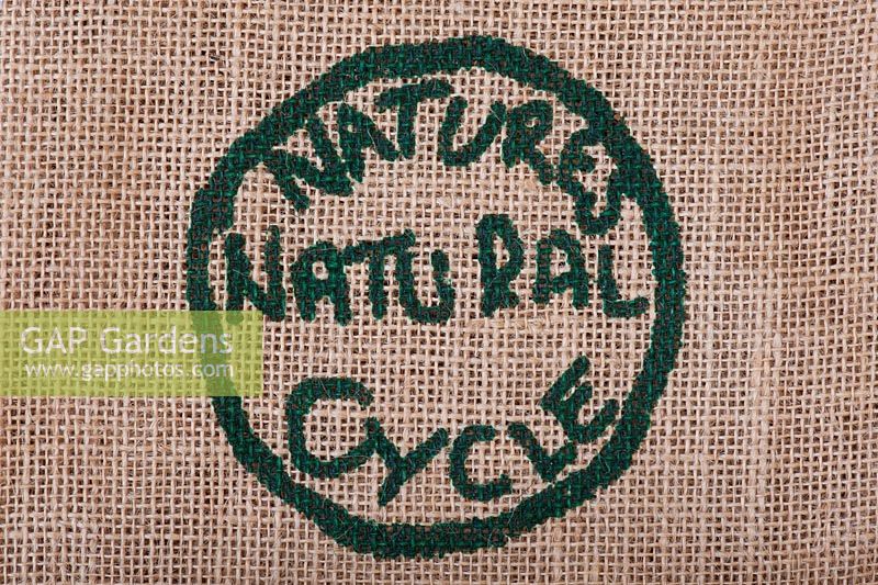 Natures natural cycle label printed on a hessian sack