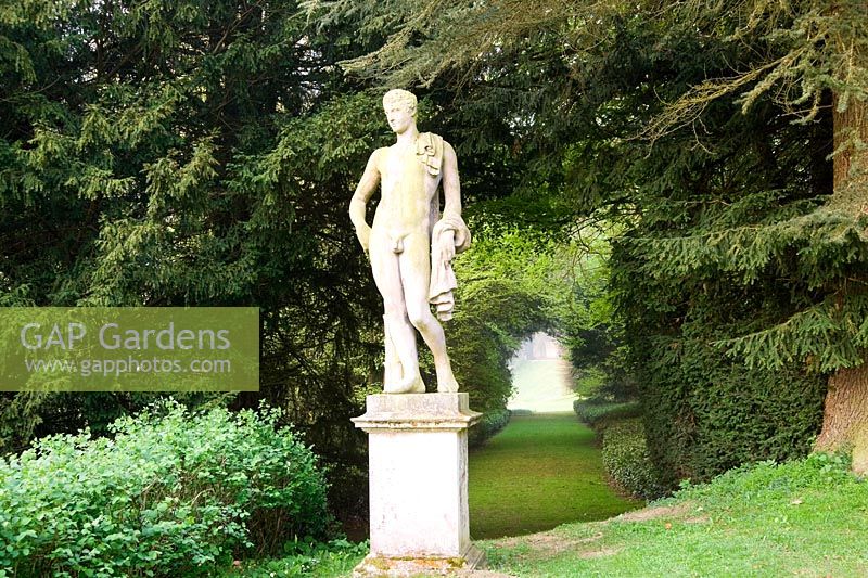 Statue of Apollo with the Long Walk stretching behind, part of Charles Bridgeman's original garden scheme - Rousham House, Bicester, Oxon, UK
