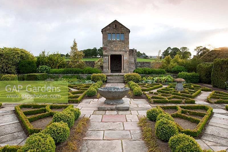 The Fancy Garden includes a gazebo, from which to gaze upon the garden, and a pattern made from box based on a Tudor rose pattern - Herterton House, Hartington, Northumberland, UK