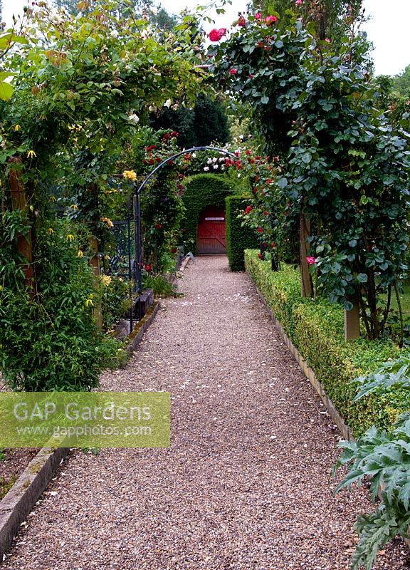 The rose arch leading to the kitchen garden. Marle Place