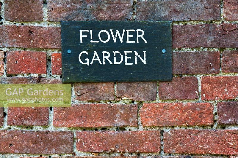Flower Garden sign on a wall at the Lost gardens of Heligan, Cornwall, England