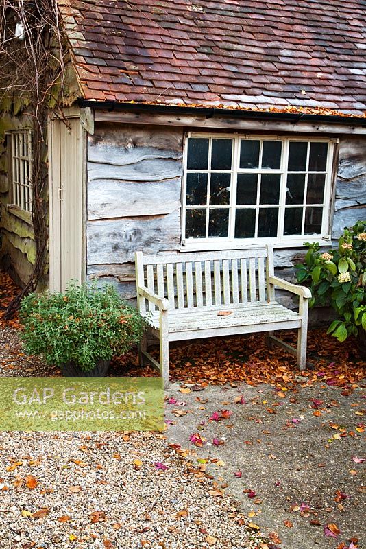 Wooden bench alongside shed. Coates Manor, Sussex
