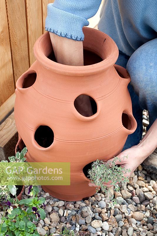 Step by step - Planting herbs and flowers in a herb planter. Pot by Dunne and Hazell