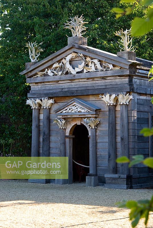 Upper terrace in the Collector Earl's Garden features a temple made from oak decorated with deer antlers, designed by Julian and Isabel Bannerman. 