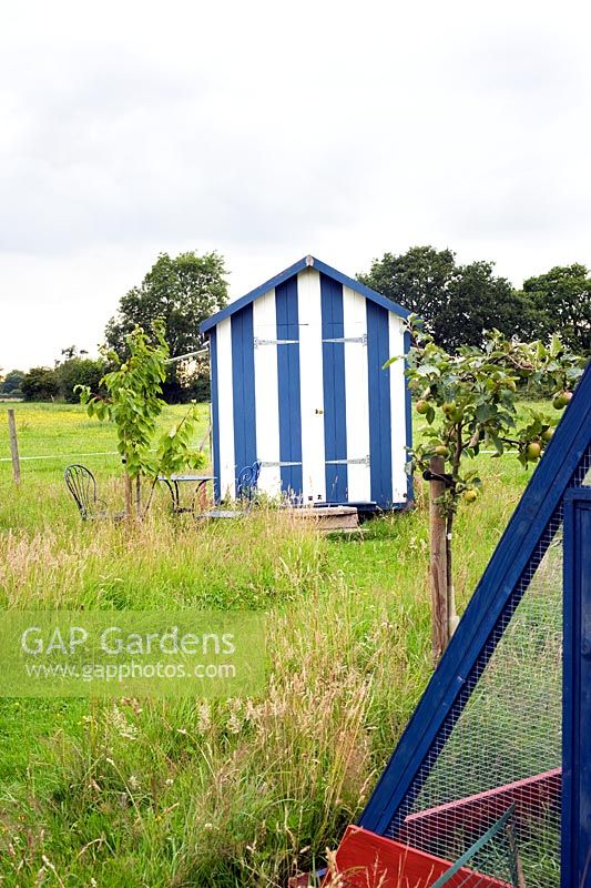 Blue and white striped garden hut
