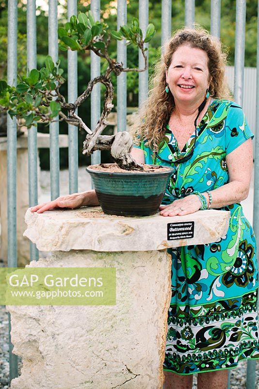 Miriam Charles, horticulturist, with a bonsai trained by her mother since 1978 - Heathcote Botanical Gardens, Florida
