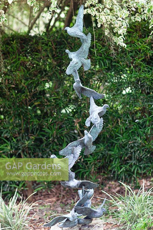 Bronze 'Doves of Peace' sculpture in the White Garden at Leu Gardens, Orlando, Florida