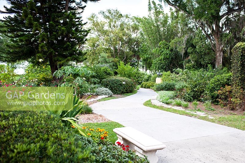 The main path leading from the museum to the gardens is lined with tropical plants - Albin Polasek Museum 