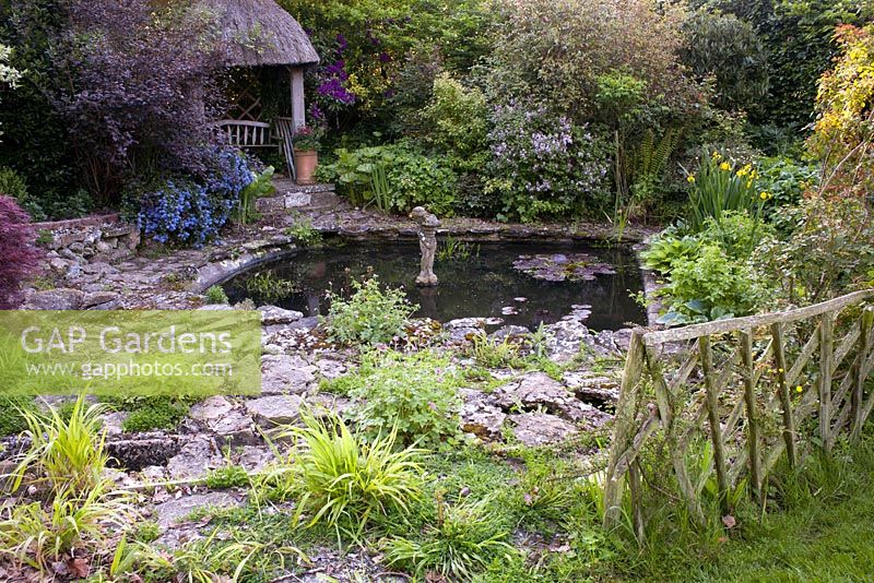 Circular pond surrounded with borders, Wyckhurst Kent