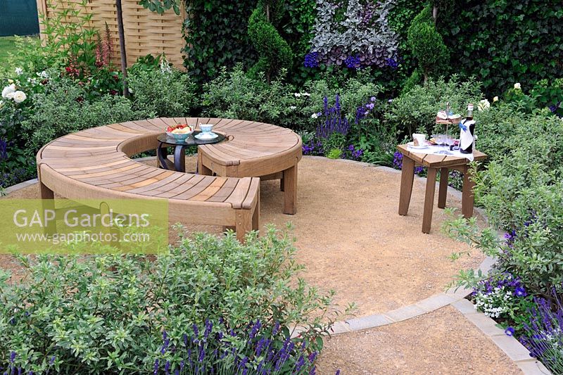 Circular timber bench in the celebration and Jubilation garden. Hampton Court Palace Flower show 2012