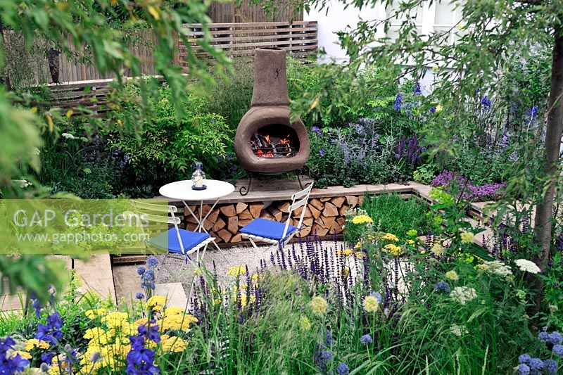 Sunken Patio area with Chiminea and reclaimed scaffolding boards used as decking. Our First home Our first garden, Hampton Court Palace flower show 2012