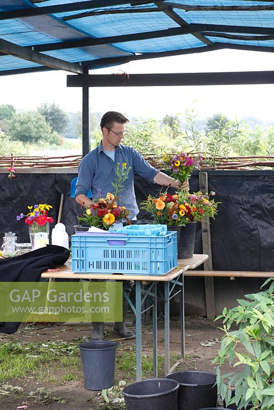 Martin Heutink creating a bunch of organic flowers for his clients at nursery Bloemrijk