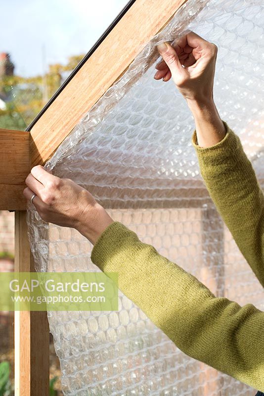 Step-by-step - Attaching bubble wrap to interior of greenhouse