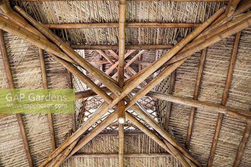 The Bamboo Pavilion is constructed with nearly 350 stems of Guadua angustifolia smoked bamboo and over 9,000 Sabal Palm fronds for the thatched roof made by the Seminole indians - McKee Botanical Garden, Vero Beach, Florida