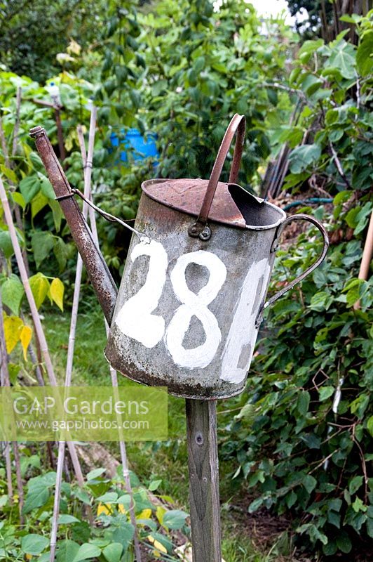 Allotment plot identified by number 28B written on old galvanised watering can, Golf Course Allotments, Muswell Hill.