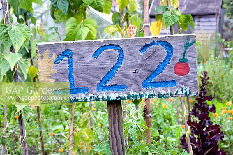Hand painted allotment plot number 122 sign, Golf Course Allotments, London Borough of Haringey