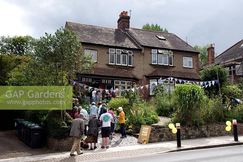 People visiting a front and back suburban garden open under the National Garden Scheme, NGS, Alexandra Park Road Gardens Group, London Borough of Haringey