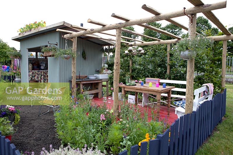 An old tin field shelter has been converted into a preserving kitchen - Preserving the Community - Silver medal winner - RHS Hampton Court Flower Show 2012.