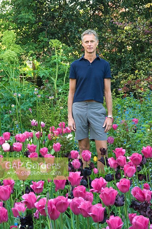 Portrait of Charles Rutherfoord with Tulipa 'Barcelona' and 'Black Swan'