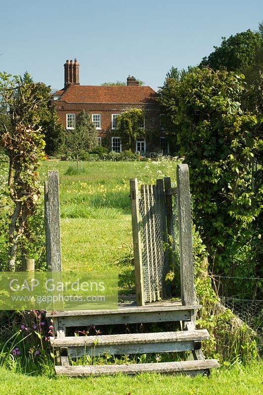 Rustic gate and steps to garden
