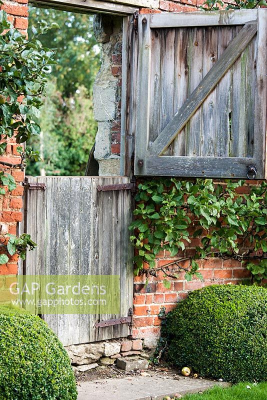 Wooden gate. Sarah Price's garden design in Garsington.