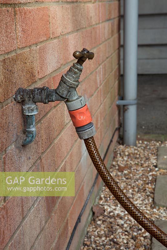 External tap, with hosepipe connected, Gardena type connection
