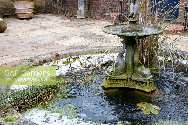 Italian themed patio area with central fountain and pond - The Old Rectory, Surrey