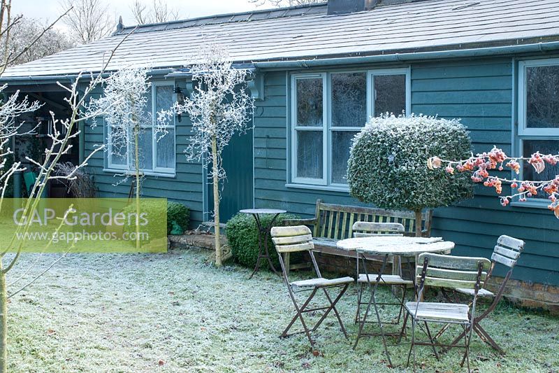 View of out building on a frosty morning with rustic garden furniture in December - The Mill House, Little Sampford, Essex