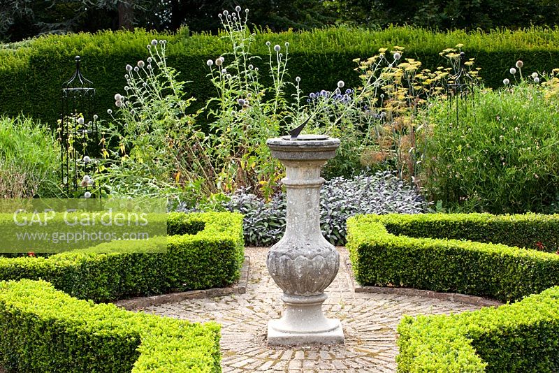 Chilstone Linford Sundial in a formal knot garden in Capel Manor Gardens, London