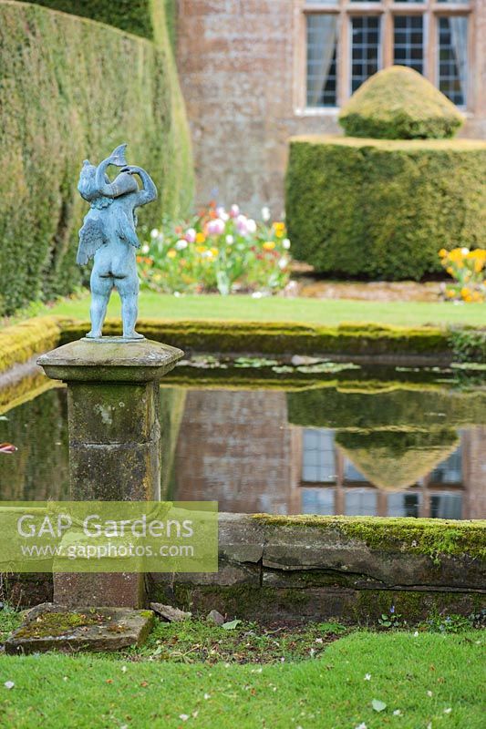 Formal pond on terrace with putto. Wayford Manor, Wayford, Crewkerne, Somerset, UK