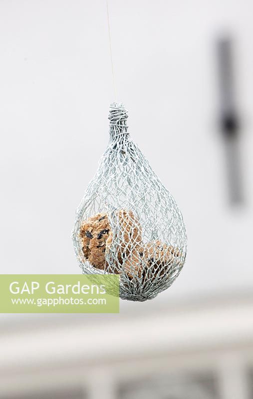 Suspended modern bird feeder made from chicken wire