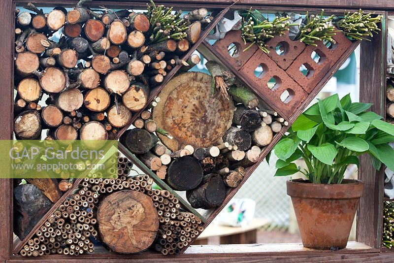 Garden dividers made using recycled materials for animals to nest in