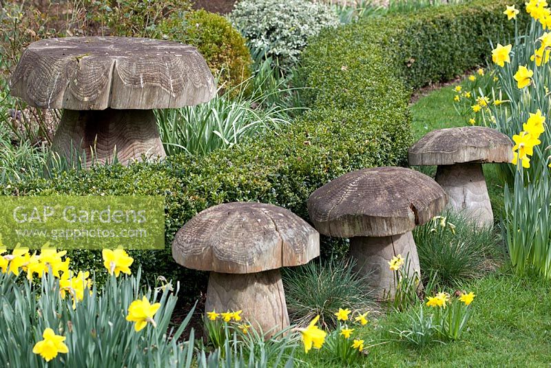 Wooden toadstools at Millennium Garden, Lichfield, in spring