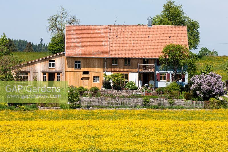 German country house with a shed and both traditional and modern elements 