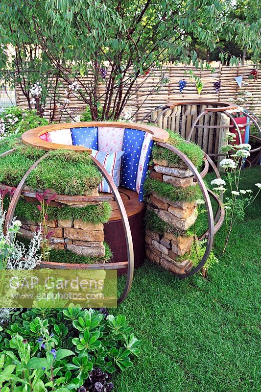 Contemporary built-in chair using turf and stones with metal framework. Home spun, RHS Hampton Court Flower show 2013, Design - Kasia Howard