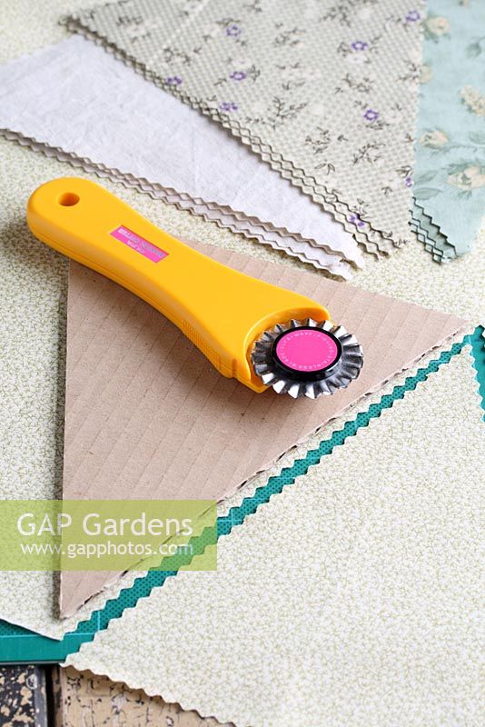Step by step of making garden bunting - Using a triangle template, cutting fabrics with a rotary cutter