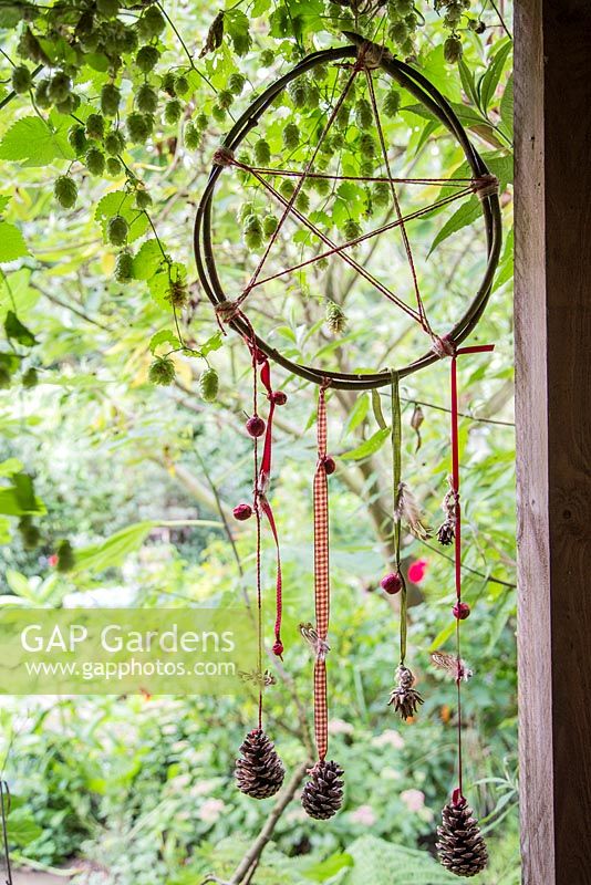 Dreamcatcher with ribbons and pinecones