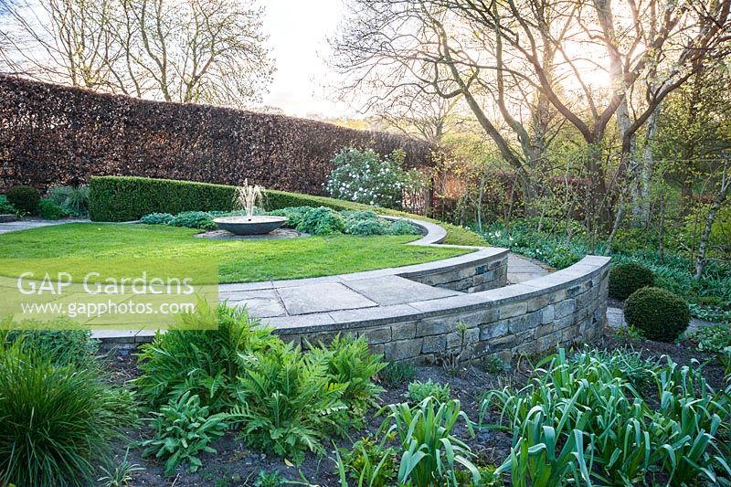 Sybil's Garden, previously site of a vegetable patch, redesigned by Alistair Baldwin in 2005, based on a series of circles, including a sweep of box hedge and a central water feature.