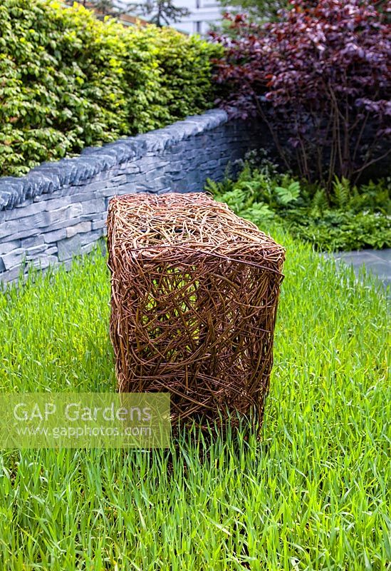 Woven willow sculptures and dry stone wall